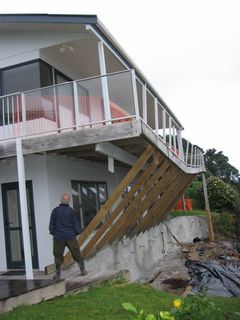 Day: Large slip beneath Paku home. EQC emergency temporary stabilisation work evident.